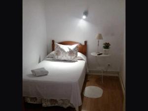 A bed or beds in a room at Casa de Huéspedes Prada