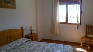 Posteľ alebo postele v izbe v ubytovaní Apartamentos Rurales Las Colinas