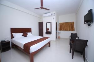 Llit o llits en una habitació de Rani Residency