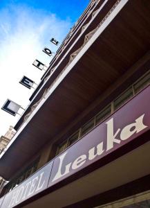 a sign on the side of a building at Hotel Leuka in Alicante