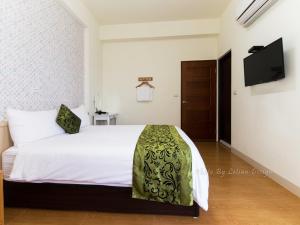 Postel nebo postele na pokoji v ubytování Four Seasons Homestay