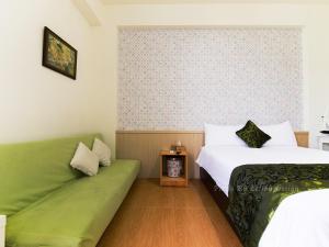 Postel nebo postele na pokoji v ubytování Four Seasons Homestay