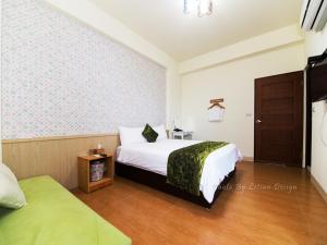 Postel nebo postele na pokoji v ubytování Four Seasons Homestay