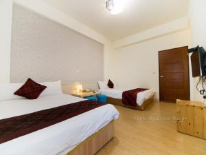 Postel nebo postele na pokoji v ubytování Four Seasons Homestay