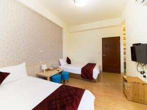 TV a/nebo společenská místnost v ubytování Four Seasons Homestay