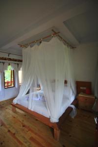 Voodi või voodid majutusasutuse Padi Ecolodge toas