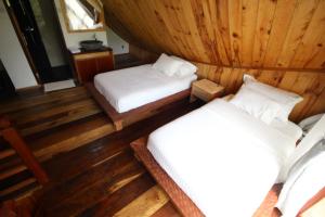 Voodi või voodid majutusasutuse Padi Ecolodge toas