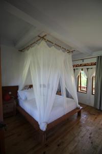 Voodi või voodid majutusasutuse Padi Ecolodge toas