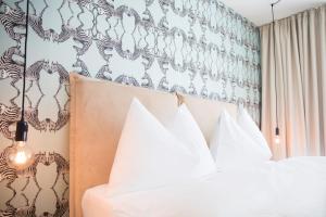 Postel nebo postele na pokoji v ubytování Gubelhof Suites