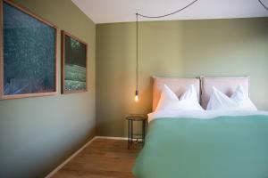Postel nebo postele na pokoji v ubytování Gubelhof Suites