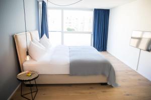 Postel nebo postele na pokoji v ubytování Gubelhof Suites