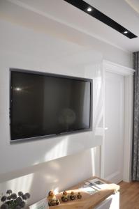 TV a/nebo společenská místnost v ubytování Golden Apartments - City Centrum