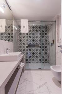 a bathroom with a shower and a sink and a toilet at Mediterraneo Emotional Hotel & Spa in Santa Margherita Ligure