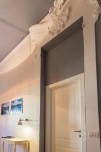 a room with a white door and a ceiling at Mediterraneo Emotional Hotel & Spa in Santa Margherita Ligure