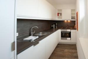 Kuchyň nebo kuchyňský kout v ubytování Appartements Marlene