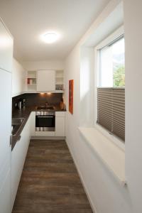 Kuchyň nebo kuchyňský kout v ubytování Appartements Marlene
