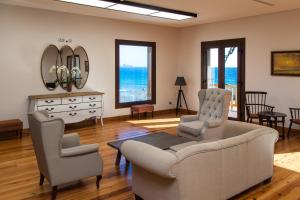 
a living room filled with furniture and a large window at Hotel el Mirador de Fuerteventura in Puerto del Rosario
