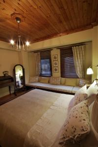 Un pat sau paturi într-o cameră la Villa Filokosta