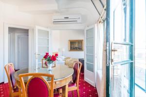 a dining room with a table and chairs at Hotel Bologna in Prague