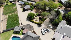 an aerial view of a yard with cars parked at Tarantula Guest House in Calvinia