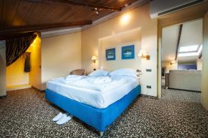Postel nebo postele na pokoji v ubytování Relais Ducale Spa & Pool