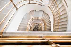 a view of a spiral staircase in a building at Hotel Bologna in Prague