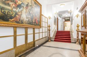 a hallway with a painting on the wall at Hotel Bologna in Prague