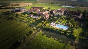 an aerial view of a house with a swimming pool at Agriturismo San Francesco in Cortona