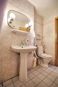 a bathroom with a sink and a toilet at Villa Johanna Guesthouse in Pärnu