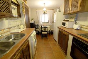 Kuchyň nebo kuchyňský kout v ubytování Casa rustica Mijas Pueblo