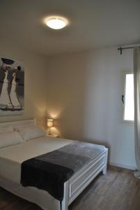 Giường trong phòng chung tại Ca Madeira II - Estoril Beach Apartments