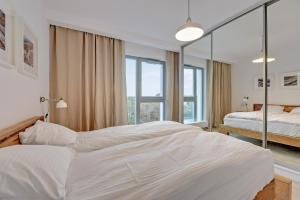 Posteľ alebo postele v izbe v ubytovaní The Darling Nadmorze by Baltica Apartments