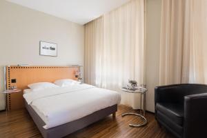 Postelja oz. postelje v sobi nastanitve GLANDON Rooms Elite