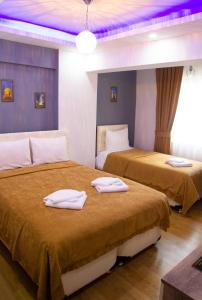 Ein Bett oder Betten in einem Zimmer der Unterkunft Figen Hotel
