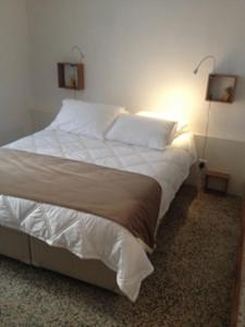 Postel nebo postele na pokoji v ubytování Ida Chambres d'hôtes B&B
