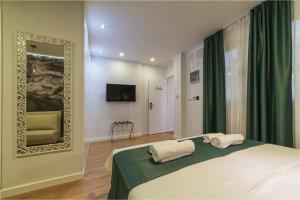 Cama o camas de una habitación en Hotel Ciudad del Mar