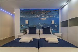 Cama o camas de una habitación en Hotel Ciudad del Mar