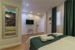 Cama o camas de una habitación en Hotel Ciudad del Mar