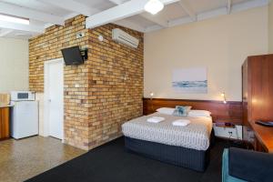 Ένα ή περισσότερα κρεβάτια σε δωμάτιο στο Albany Holiday Units