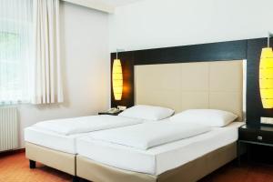 Postelja oz. postelje v sobi nastanitve Hotel Plattenwirt