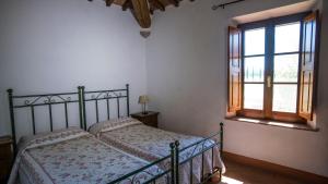 A bed or beds in a room at La Casa del Contadino