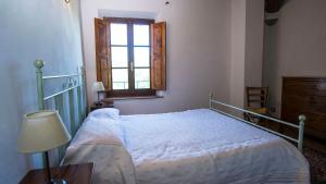 A bed or beds in a room at La Casa del Contadino