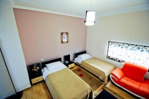 Postel nebo postele na pokoji v ubytování Hotel Lubjana