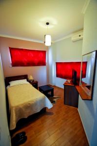 Postel nebo postele na pokoji v ubytování Hotel Lubjana