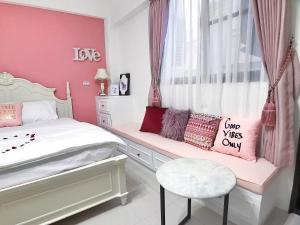 Postel nebo postele na pokoji v ubytování Lovi Time B&B