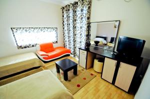 TV a/nebo společenská místnost v ubytování Hotel Lubjana