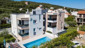 an aerial view of a house with a swimming pool at Villa Piramida in Trogir