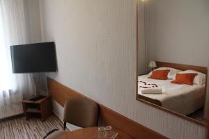 Postel nebo postele na pokoji v ubytování Hotel Bursztyn