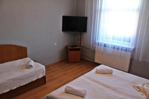 Postel nebo postele na pokoji v ubytování Hotel Bursztyn