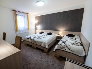 Posteľ alebo postele v izbe v ubytovaní Penzion Almada
